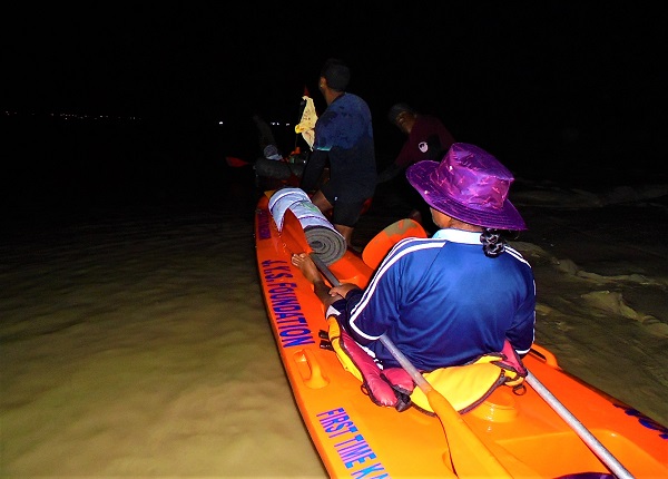 People in Kayak at night